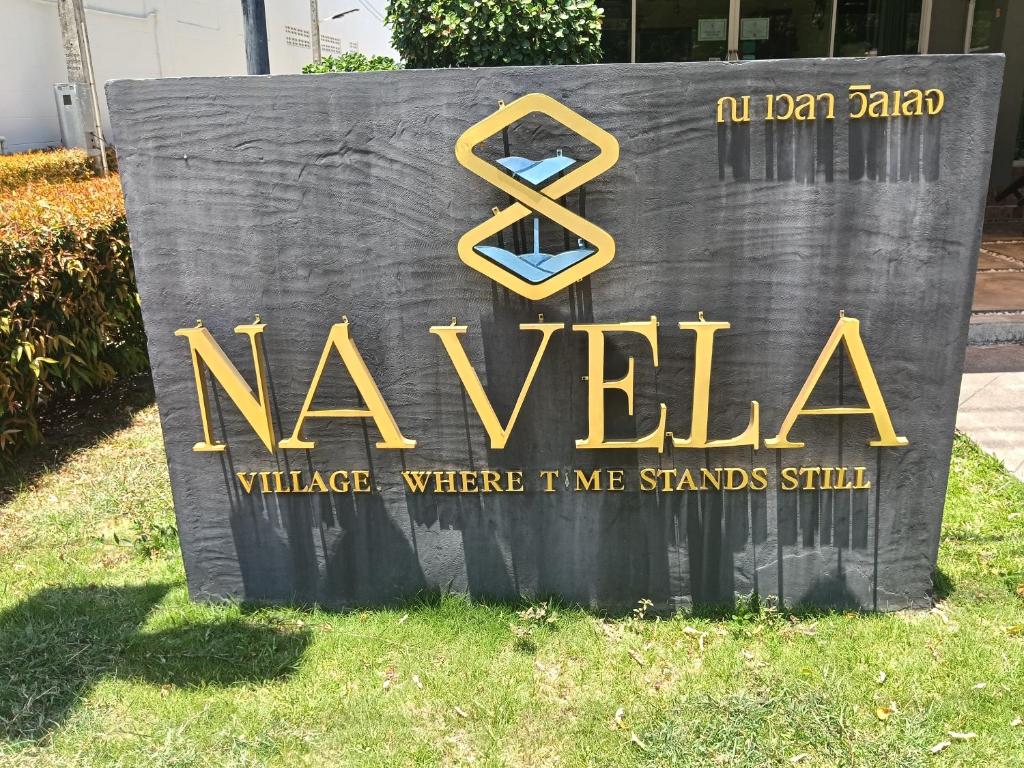 a sign that says naya village where im me standsstill at Navela in Ko Lanta