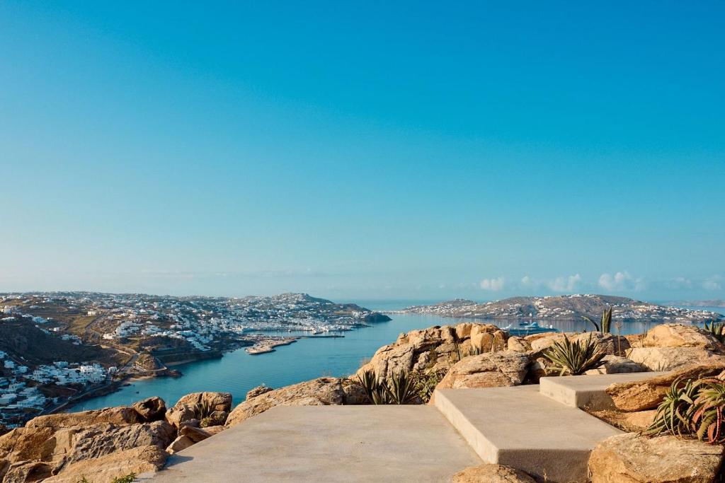 a view of a body of water from a mountain at Villa Almi in Mykonos in Tourlos