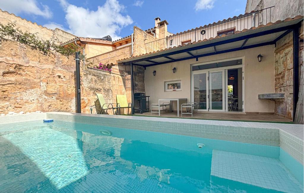 a house with a swimming pool next to a building at Convent Holiday Home in Petra