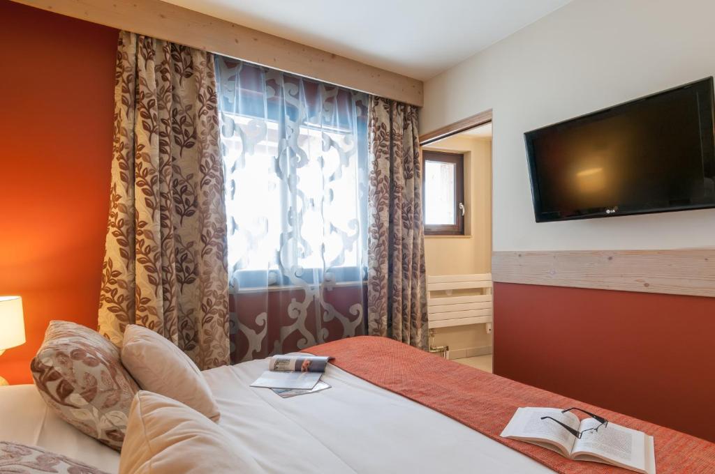 Postel nebo postele na pokoji v ubytování Résidence Pierre & Vacances Premium L'Amara