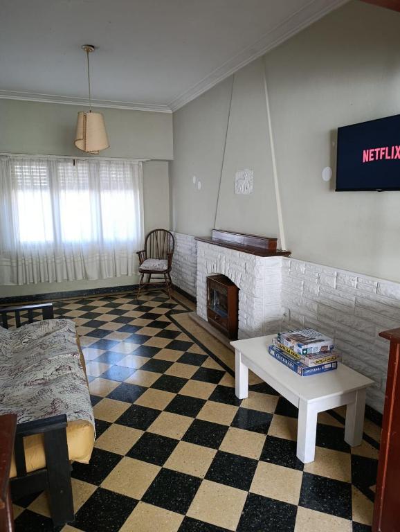 a living room with a couch and a fireplace at Sierras & Urbana in Tandil