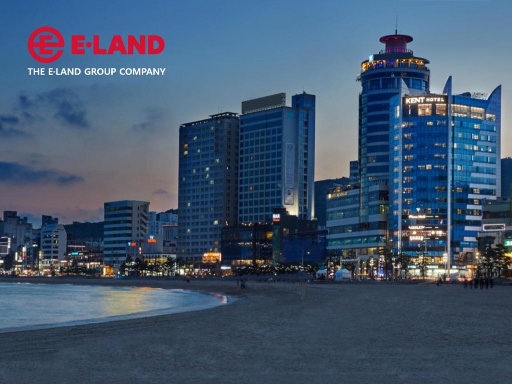 a city skyline at night with tall buildings at Kent Hotel Gwangalli by Kensington in Busan