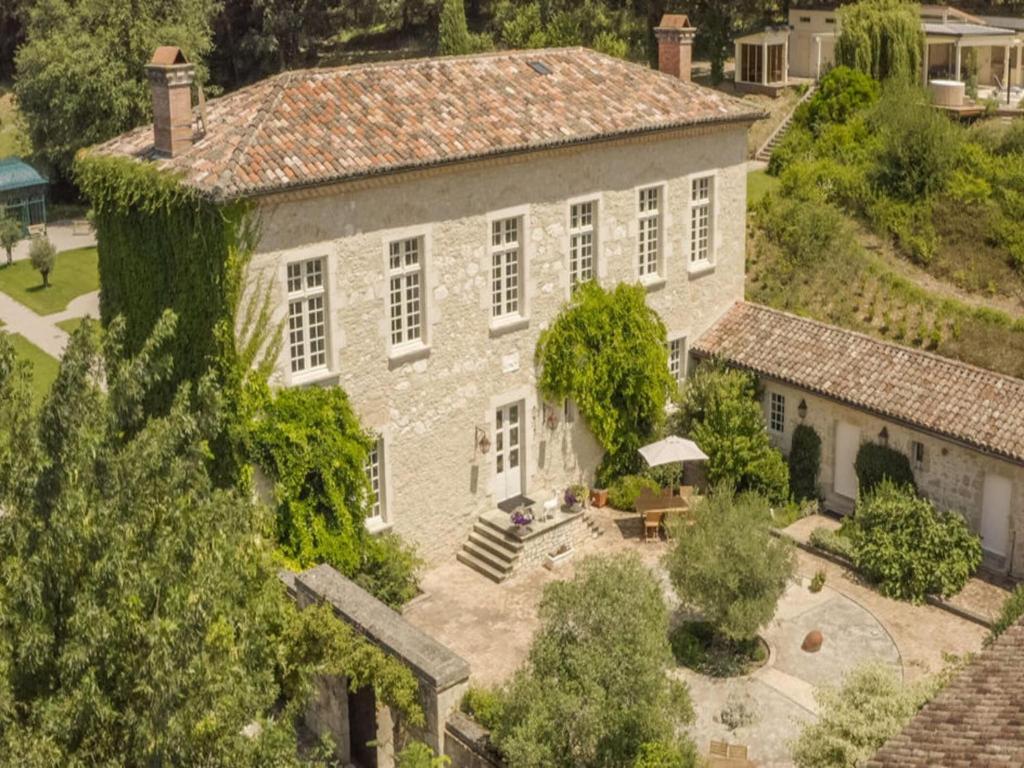 an aerial view of a large stone house with trees at French Estate with Pool & Sauna in Damiatte