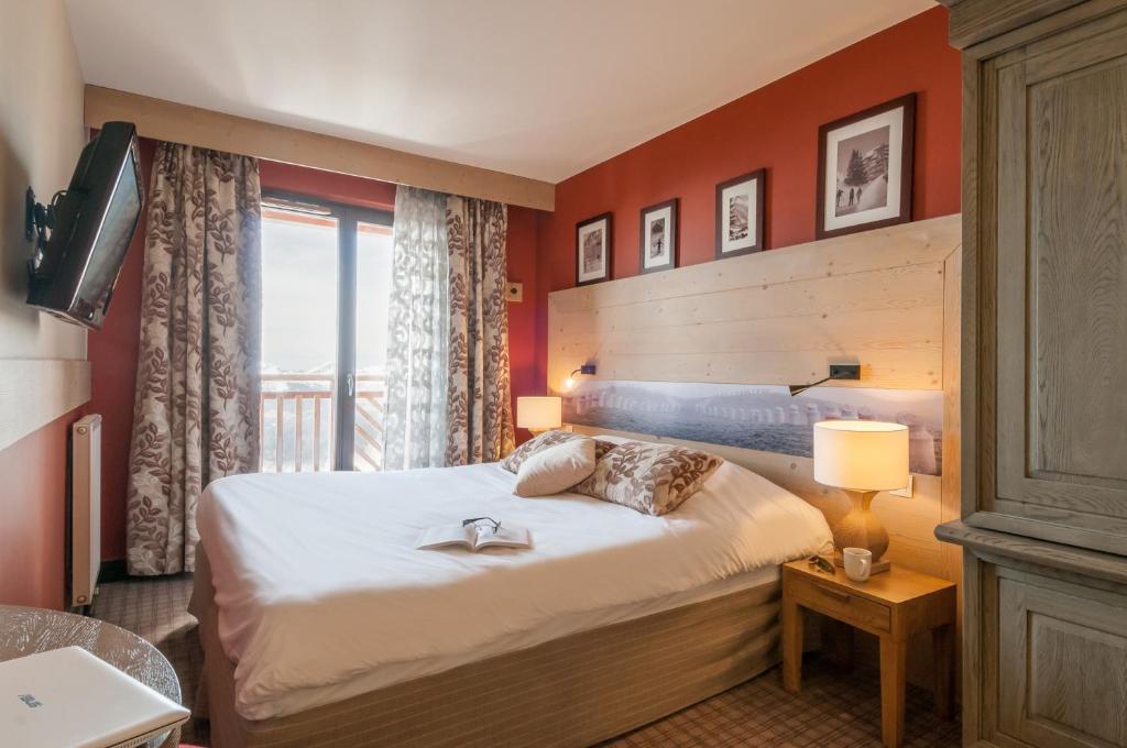 Postel nebo postele na pokoji v ubytování Résidence Pierre & Vacances Premium L'Amara
