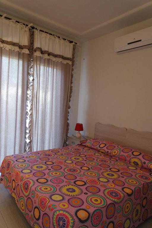 Postel nebo postele na pokoji v ubytování Edonè B&B