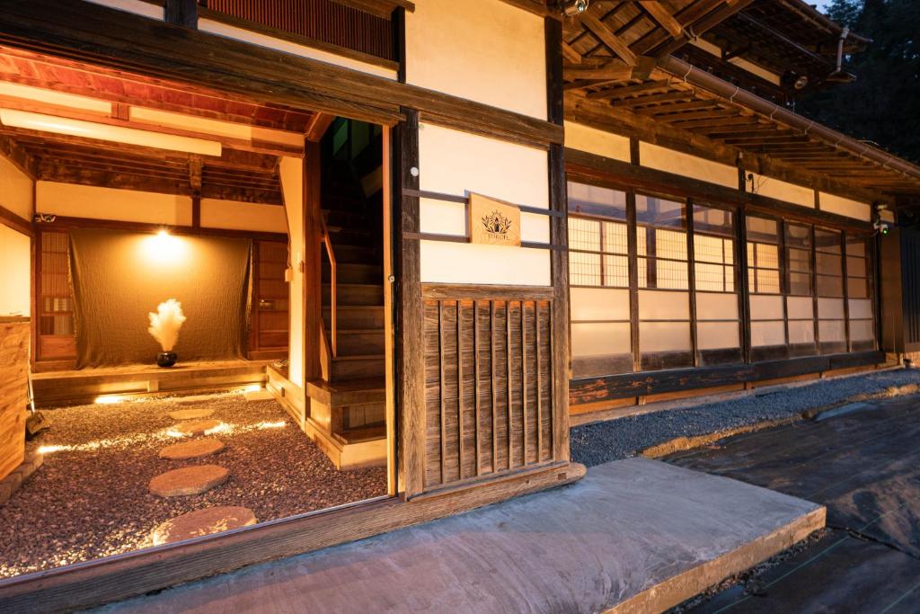 an entrance to a building with a gate at 古民家宿torch in Fujikawaguchiko