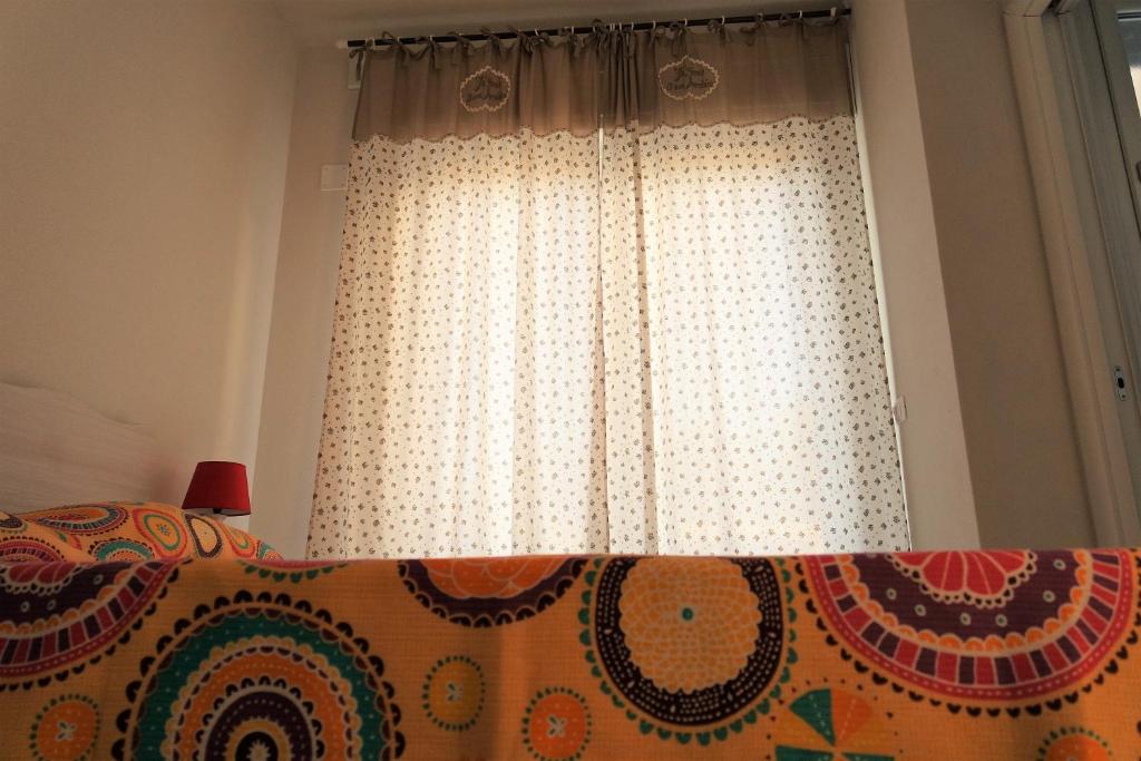 Postel nebo postele na pokoji v ubytování Edonè B&B