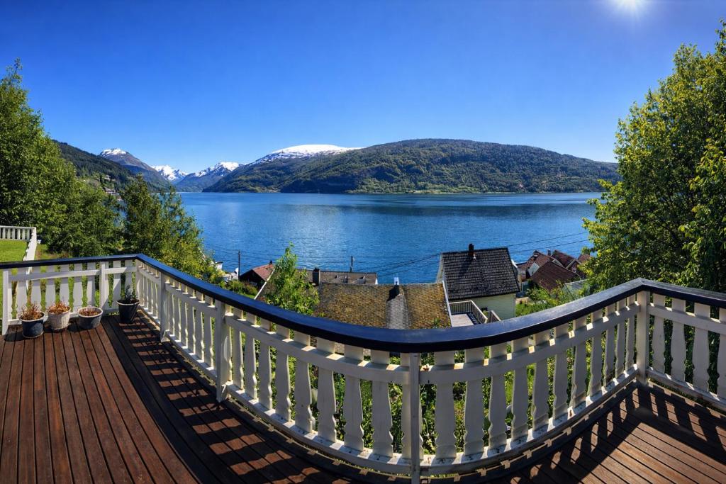 a deck with a view of a lake at Faleide Panorama Private Fjord View Cabin with Large Terrace in Stryn