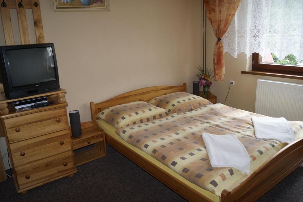 Postel nebo postele na pokoji v ubytování Privat u Babky