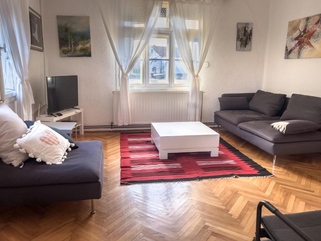 a living room with a couch and a coffee table at Ethno House Andrej in Korbovo