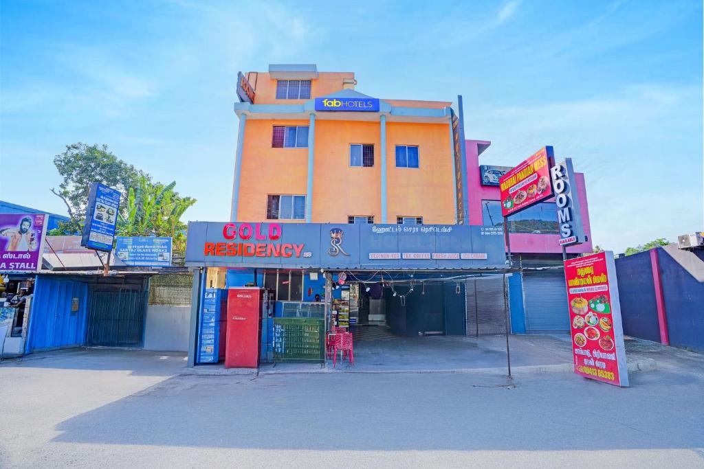 a building with a sign in front of it at FabHotel Gold Residency in Chennai
