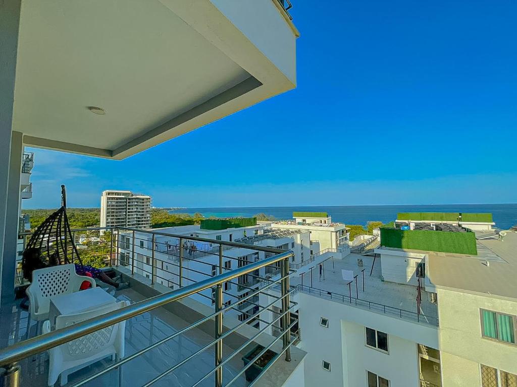 a balcony of a building with a view of the ocean at Aqua seaside Apartments in Mombasa