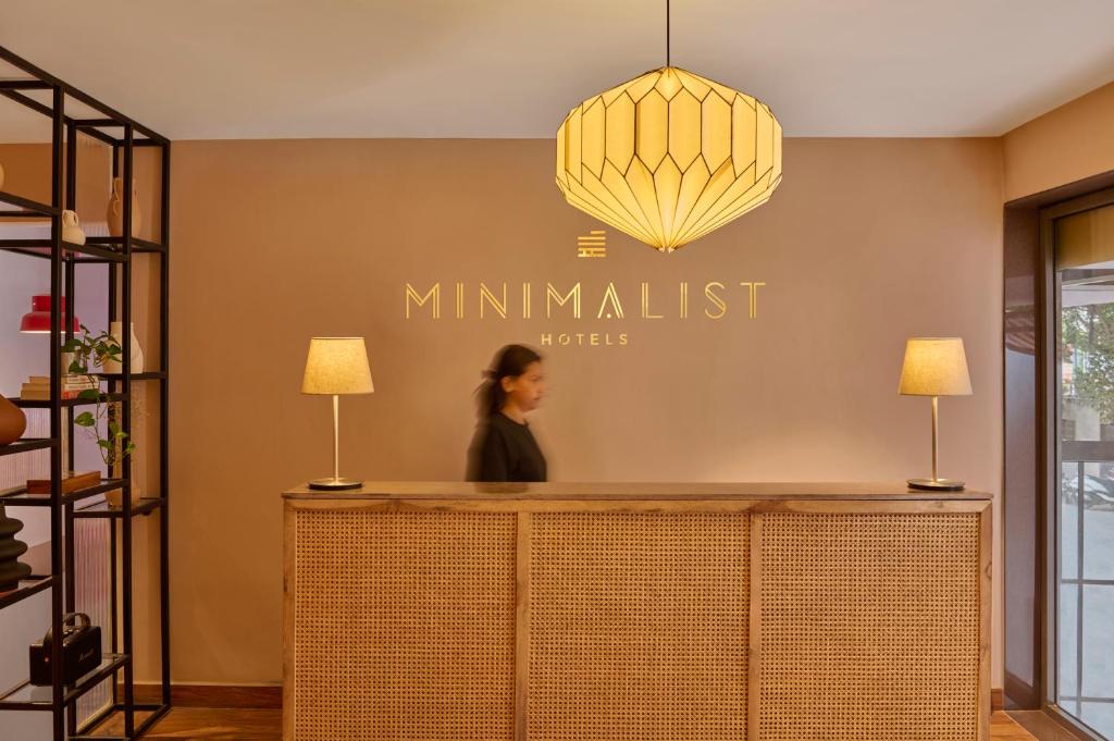 a woman standing at the counter of a millimanitz store at Minimalist - The Varanasi Edit in Varanasi