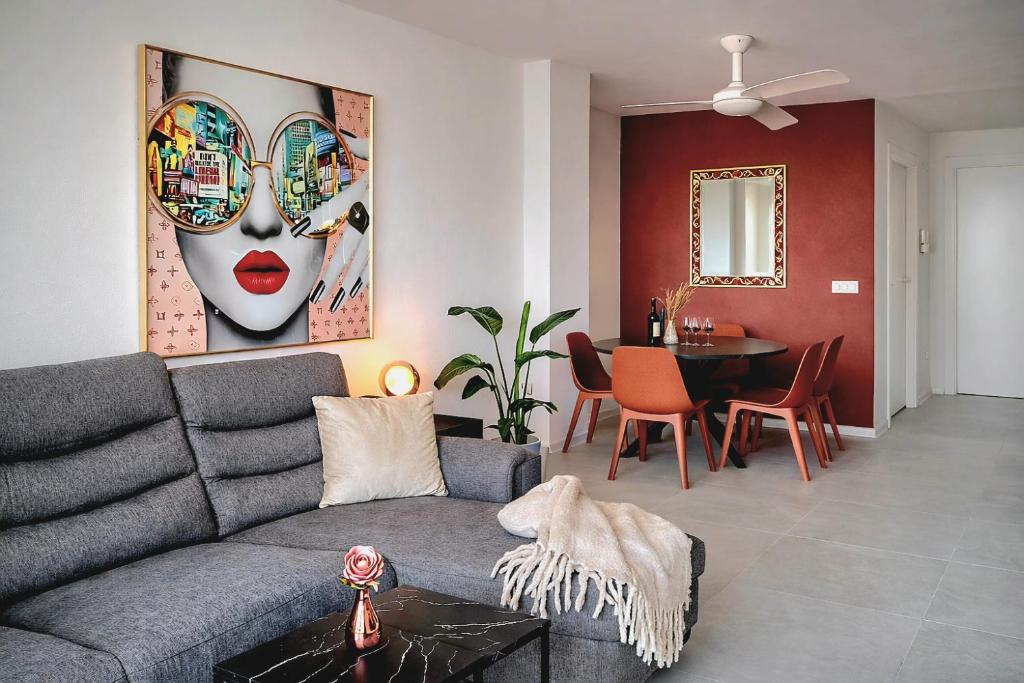 a living room with a couch and a dining room at Casa Nina Novastar in San Pedro del Pinatar