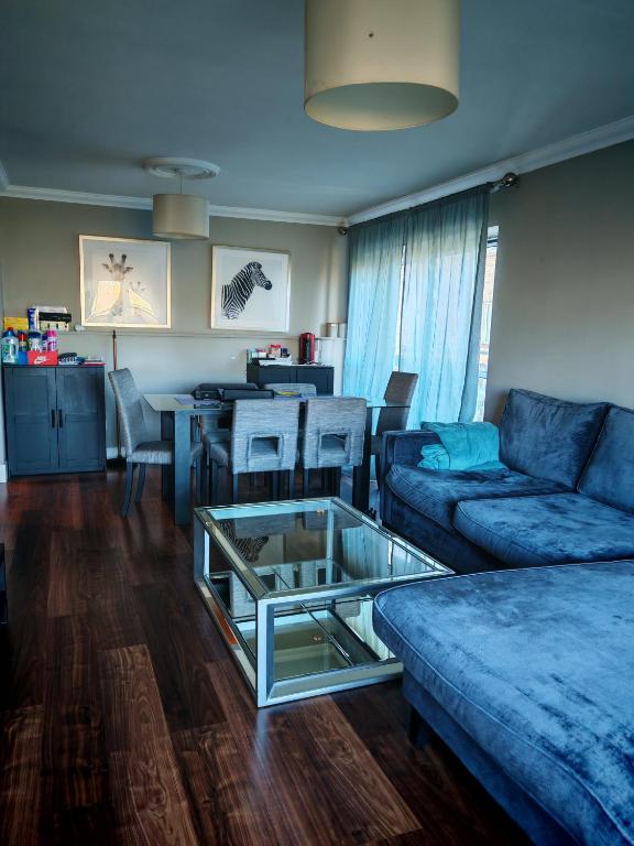 a living room with a couch and a table at Bedroom in Blanchardstown in Blanchardstown