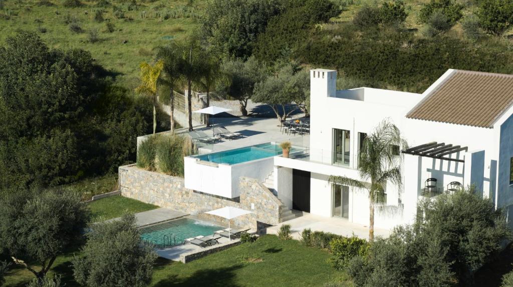 an aerial view of a house with a swimming pool at Arbora Olea Luxury Villas in Skaleta