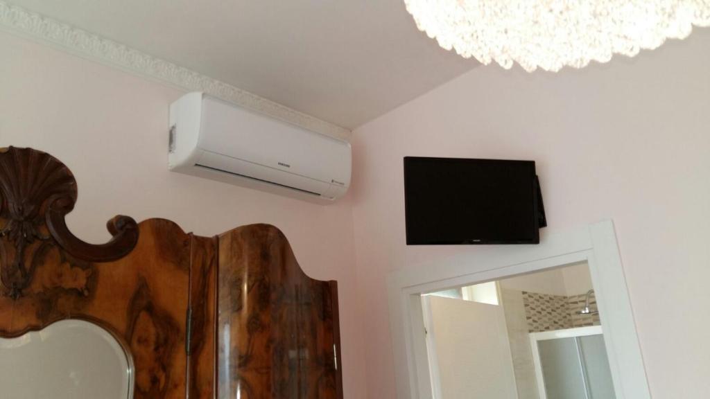 TV a/nebo společenská místnost v ubytování B&B Domus Lupiae