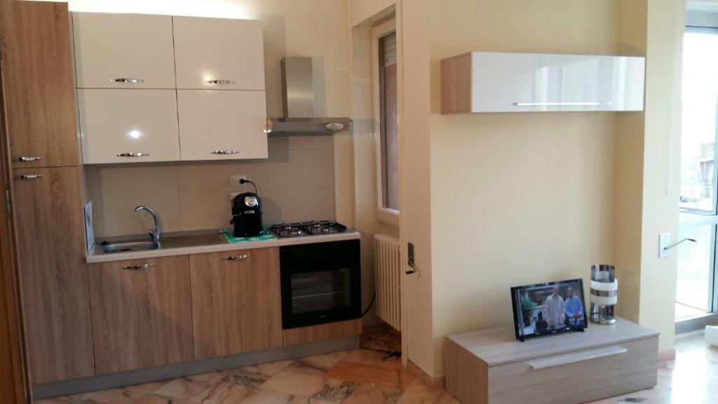 Kuchyň nebo kuchyňský kout v ubytování B&B Domus Lupiae