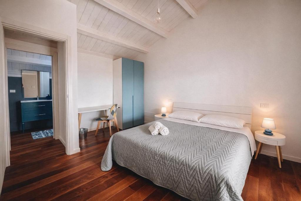 a bedroom with a bed with two white pillows at Galé Suite Apartment in Chieti