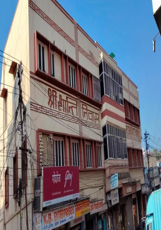 a building with a sign on the side of it at Hotel Shri Shanti Niwas in Bikaner
