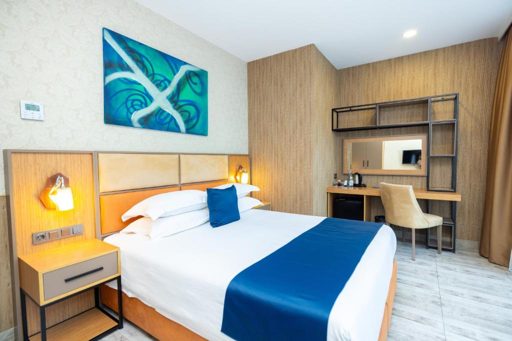 Ліжко або ліжка в номері New Wave Hotel