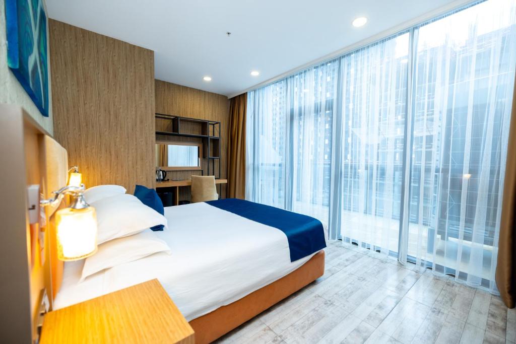Ліжко або ліжка в номері New Wave Hotel