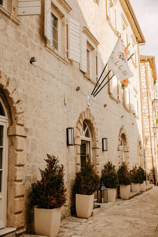 a kite hanging from the side of a building at Vila Perast Boutique Hotel in Perast