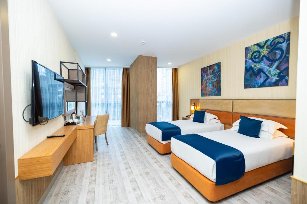Телевізор і / або розважальний центр в New Wave Hotel