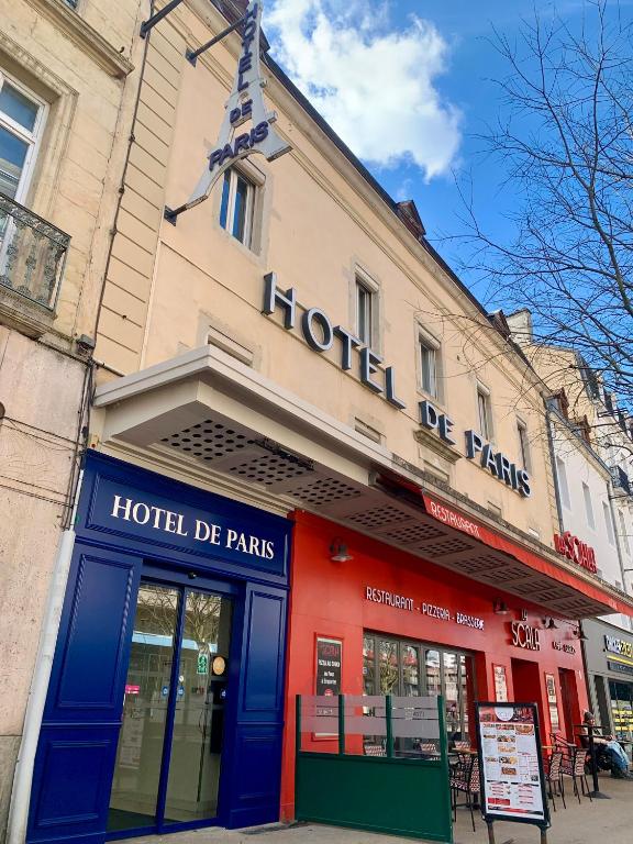 a hotel building with a red and blue facade on a street at Hôtel de Paris - Dijon Centre Gare in Dijon
