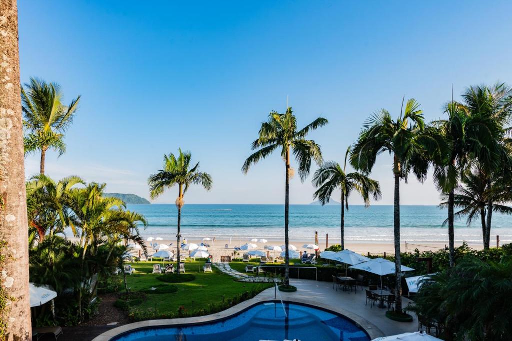 a view of the beach from the balcony of a resort at Pousada Alcatrazes in Juquei