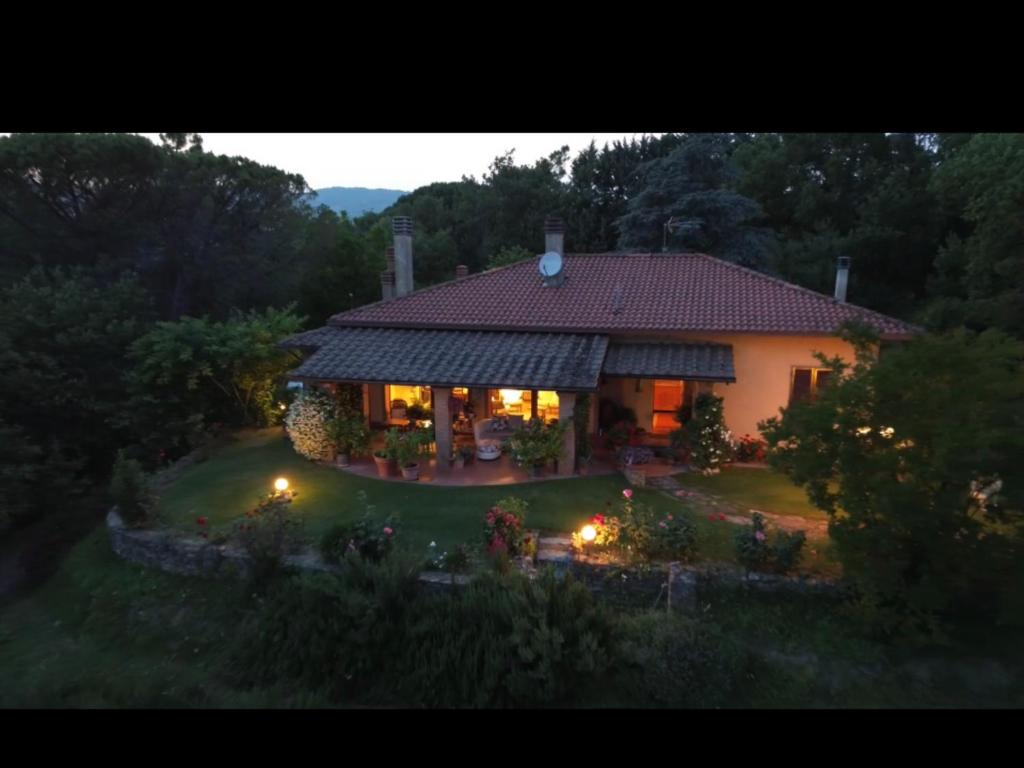 a large house with a garden in front of it at Villaspino in Capolona