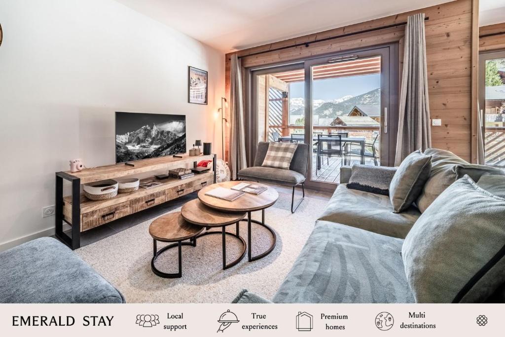 a living room with a couch and a table at Apartment Montami, Châtel - by EMERALD STAY in Châtel