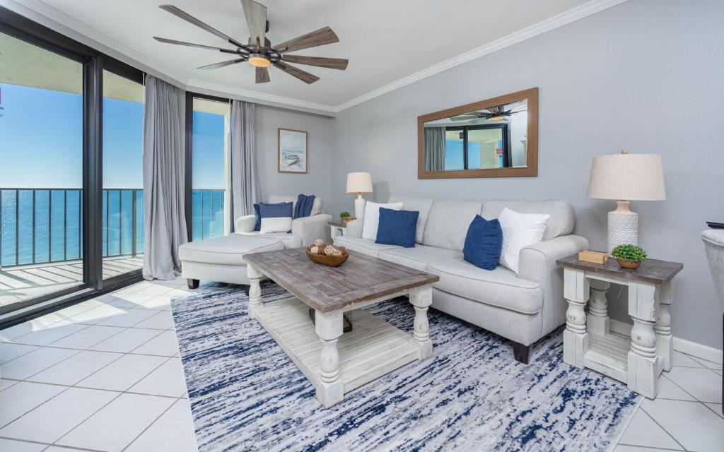 a living room with a couch and a table at Phoenix III 3126 in Orange Beach