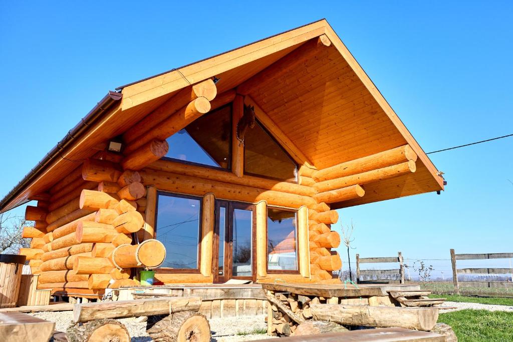 a log home on a pile of logs at Golden Log House in Hajdúszoboszló