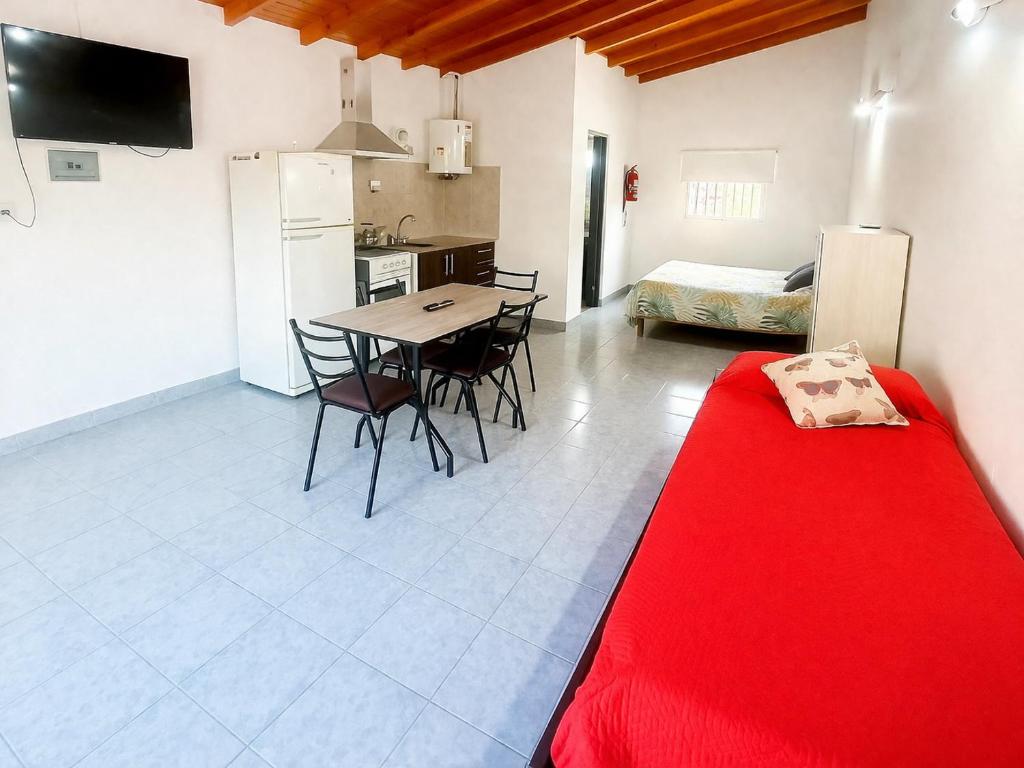 a kitchen and dining room with a table and chairs at Gotas de Rocío - para 4 en San Antonio Oeste in San Antonio Oeste
