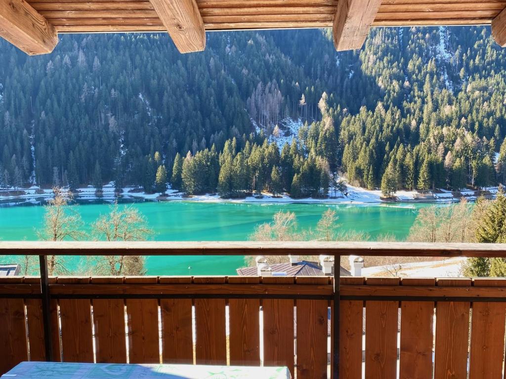 a view from a balcony of a lake at Mansarda vista lago in Auronzo di Cadore