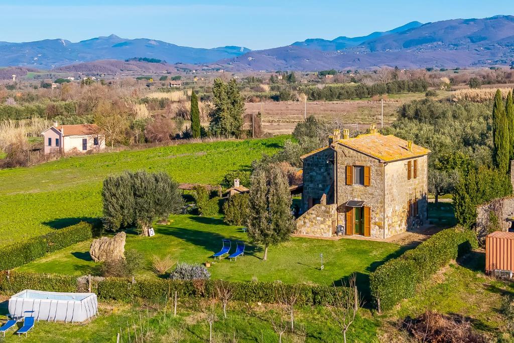 an aerial view of a stone house in a field at Le Sorgenti in Pitigliano