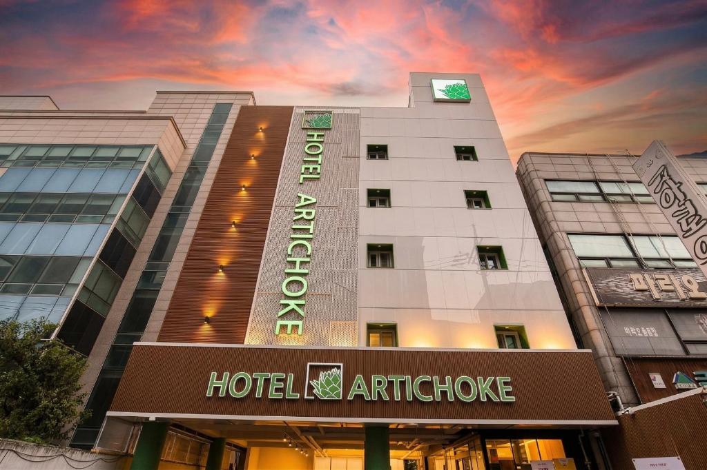 a hospital building with a sign that reads hotel architecture at 아티초크 호텔 in Kajŏng-dong