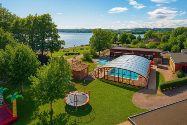 an aerial view of a building with a playground at Camping maeva Escapades Domaine de la Vingeanne in Longeau