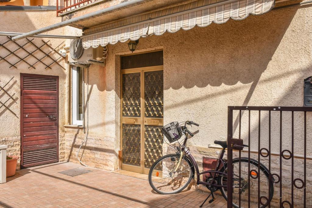 a bike parked outside of a building with a door at Da Nonna Mena in Fossacesia