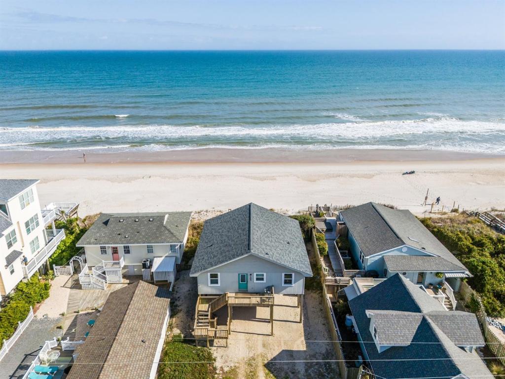 an aerial view of a beach with houses and the ocean at Perched on the Dune In the Heart of Surf City in Surf City