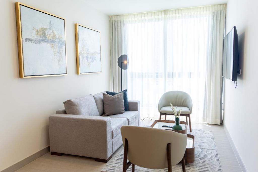 a living room with a couch and a chair at Condo Suite 2BR With View in Panama City