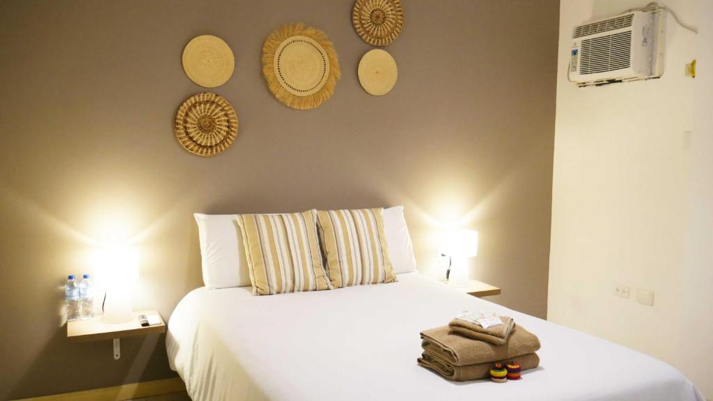 Postel nebo postele na pokoji v ubytování Park View Hostel & Suites