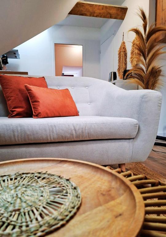 a living room with a couch and a table at La Tour du Château in Fougères