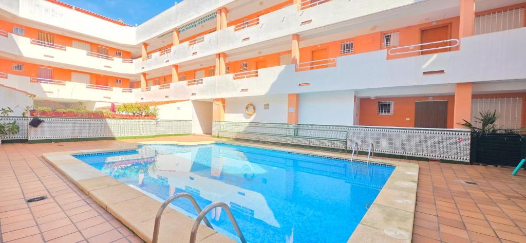 a large swimming pool in a large building at AYF PLAYA MORRO DE GOS in Oropesa del Mar