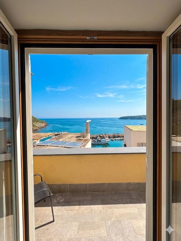 a view from a window of the ocean at Nonna Liberina in Procida
