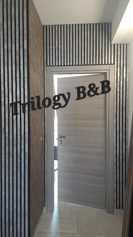 a garage door with the words happy boston above it at Trilogy b&b in Celano