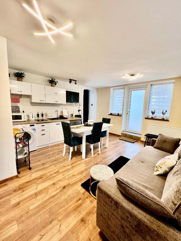 a living room with a couch and a table at Apartament tatarski PARKING! in Przemyśl