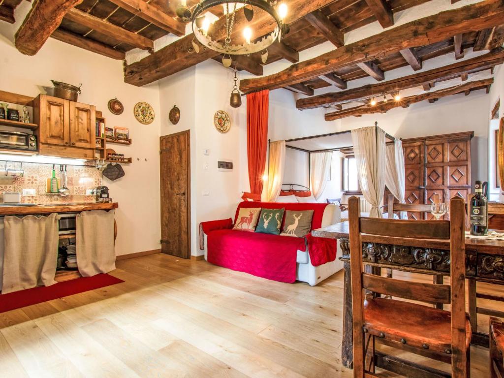 a bedroom with a red bed in a room at Apartment Maghinardo by Interhome in Palazzuolo sul Senio