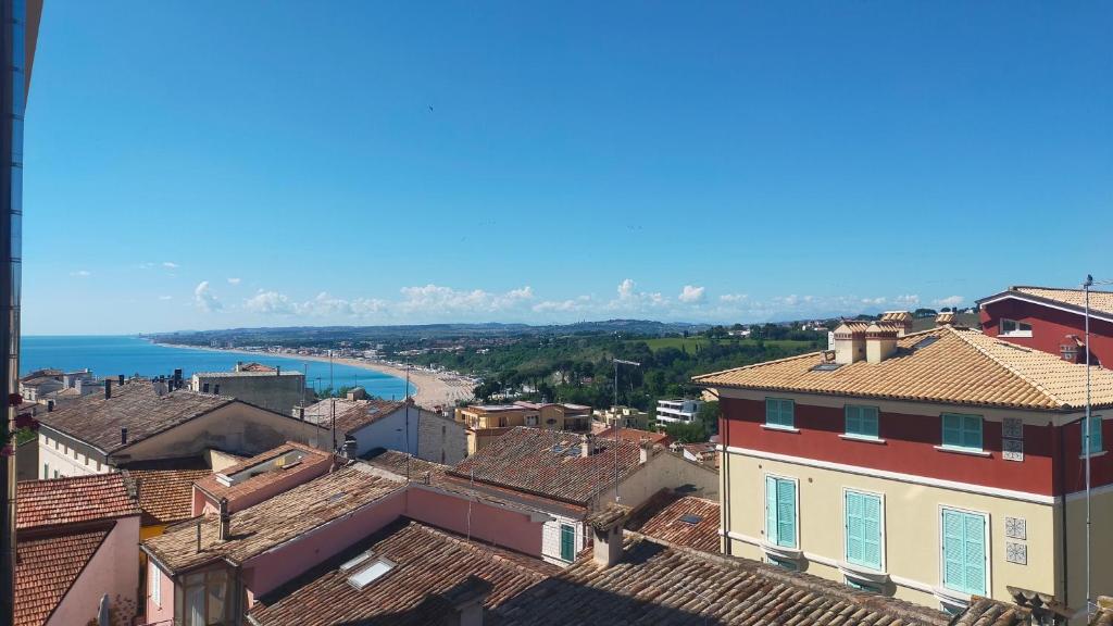 a view of a town with the ocean in the background at BILOCALE IN PIAZZA A NUMANA VISTA MARE BELLISSIMA - cod 485 in Numana